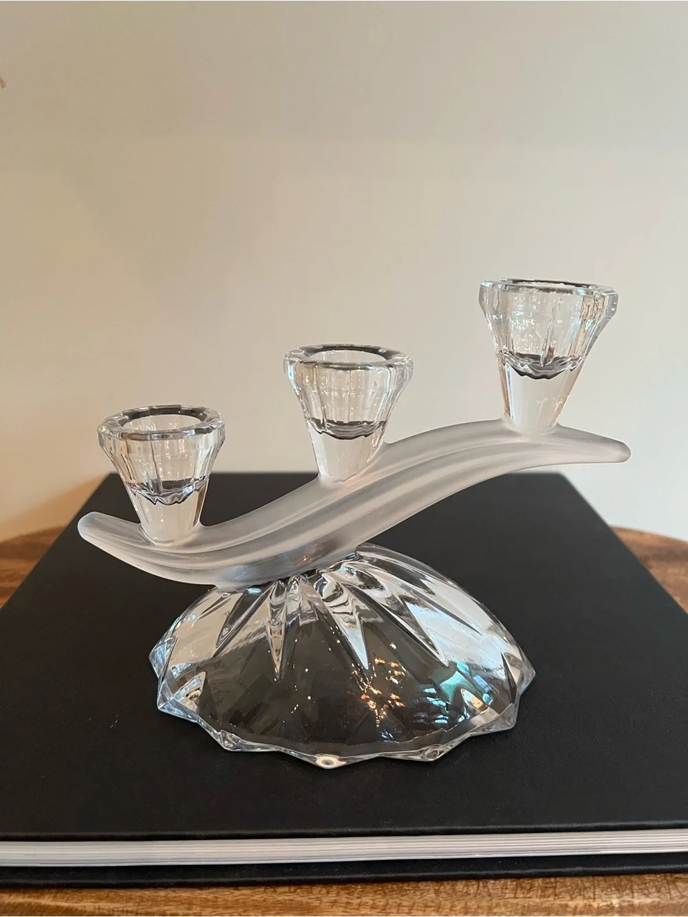 Glass candle holder Features a unique asymmetrical 